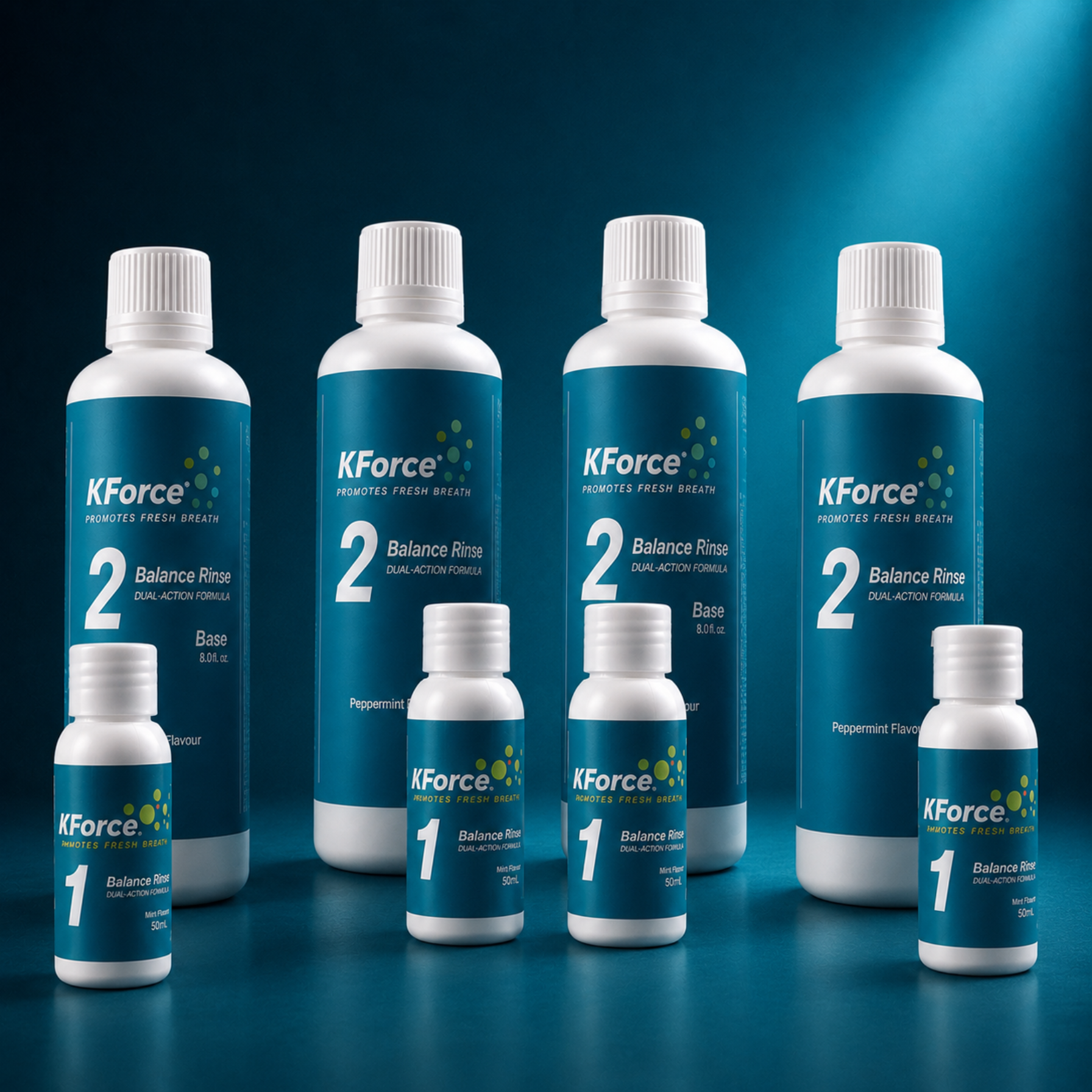 A set of KForce oral rinse bottles in two sizes, with larger white bottles labeled '2 Balance Rinse' and smaller white bottles labeled '1 Balance Rinse', arranged on a dark blue gradient background.